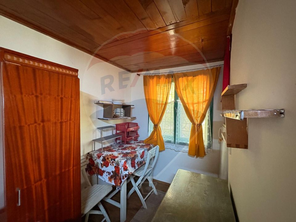 Teren intravilan 589 mp si cabana din caramida in Cuvin