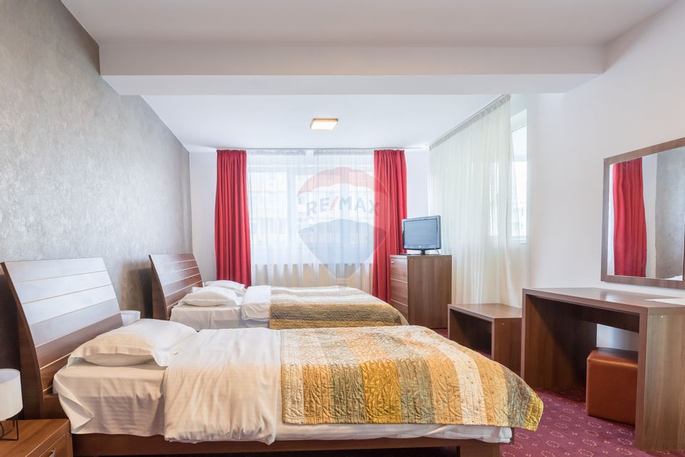 Hotel cu 23 unități de cazare, 2 săli de ședință, locație excelentă